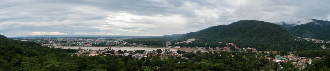 Fototapeta na wymiar A panoramic view of Rishikesh from the top of Bhootnath Temple in Rishikesh, India