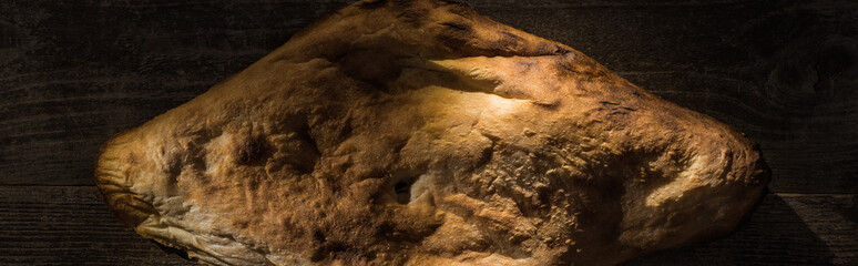 top view of delicious fresh baked pita on wooden rustic table, panoramic shot