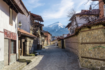 An old street in the mountain town of Bansko, now the largest mountain resort in Bulgaria. In the...