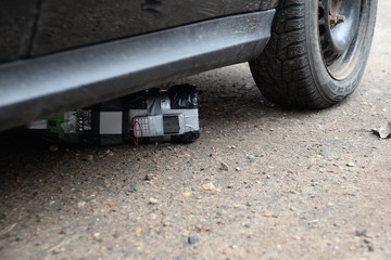 A bomb with radio control under a car. terrorism concept