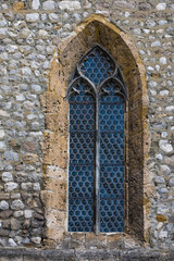 Fototapeta na wymiar gothic church window and stone wall