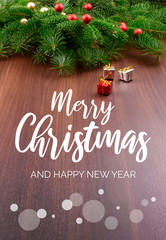 Merry Christmas and Happy New Year Sign with gift box. Christmas background with ornate spruce branch stock images. Elegant holiday background. Christmas greeting card with gift box and spruce tree