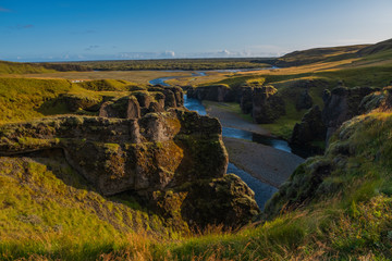 The most picturesque canyon Fjadrargljufur and the shallow creek, which flows along the bottom of the canyon. Fantastic country Iceland. September 2019.