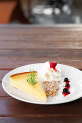 Fresh tasty lemon tart with crumble and whipped cream