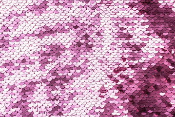 Pink purple shiny fabric with sequins, abstract background.