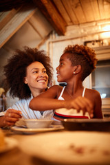 Mother and daughter enjoying Christmas dining