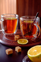 Thermo cup of black tea with lemon