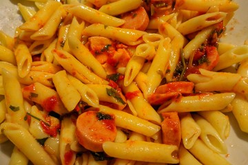 pasta with grilled sausage in tomato sauce.