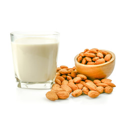 almond kernel and almond milk in the glass isolated on white background