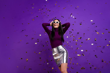 Photo of cheerful cute pretty nice charming attractive girl hanging out in night club in skirt isolated vibrant dancing purple color background