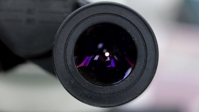 The lab with a gradual zooming on the microscope. 