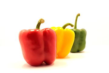 Ripe beautiful vegetables, paprika on a white background