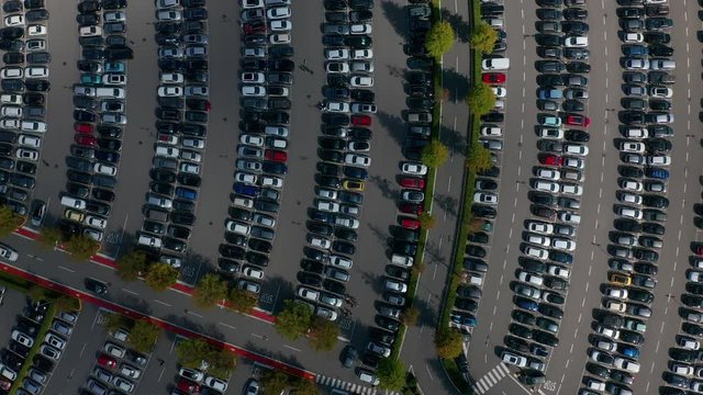 Aerial view. Parking with parked cars and road markings.