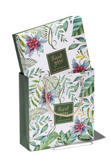 Subject shot of a gift box in a gift bag with silky plaited handles. Both items are white and decorated with colorful floral tropic print and with a pleasant text: "Thank you. Good time to meet you."