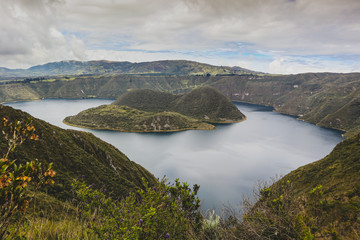 Fototapeta na wymiar Lake Cuicocha, Ecuador seen from high above on a trail around it. Majcestic lake in ecuador.