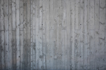 Concrete wall texture. Imprints of wooden boards used to make concrete wall are seen on concrete...