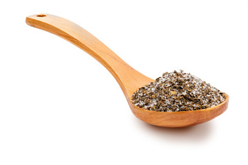 Fine and white salt with fine herbs, with various spices (rosemary, oregano and black pepper) in a wooden spoon (salt varieties collection). Isolated on white background Rustic appearance
