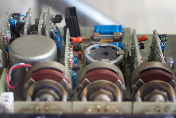 a selective focus close up of old electronic components on circuit boards