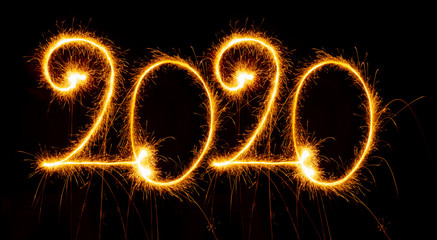 Happy New Year - 2020 with sparklers on black background