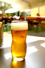 beer mug on a wooden table stands in a pub