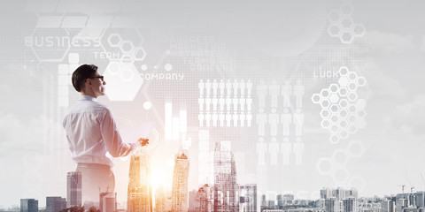 Concept of business success and control with confident boss against cityscape background
