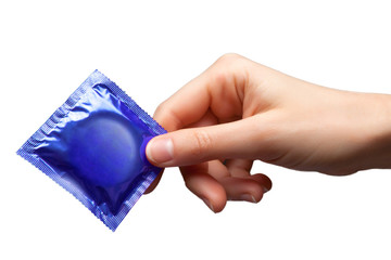 Condom in female hand isolated