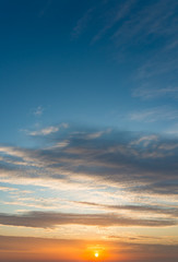 Fantastic clouds at sunrise, vertical panorama