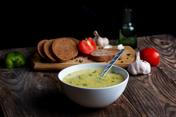 steaming hot vegetable soup and ingredients
