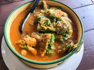 close up of Sour Curry with Vegetable Omelet, Thai style