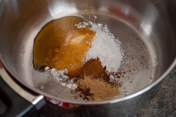 Do it yourself: Gingerbread cookies tutorial. Step by step recipe. Step 03. Put powdered sugar, honey, cinnamon, ginger, cocoa in a saucepan