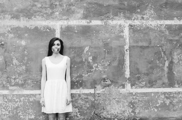Black and white shot of Portrait of woman with taped mouth