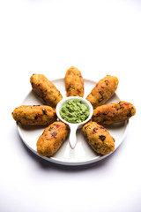 Veg Poha Roll made using flattened Rice, served with tomato ketchup and green chutney