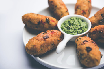 Veg Poha Roll made using flattened Rice, served with tomato ketchup and green chutney