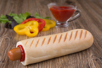 french hot dog with paprika and ketchup