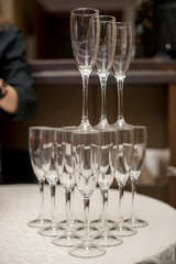 A pyramid of glasses. pink champagne with fruits.