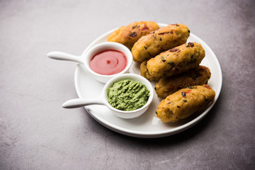 Veg Poha Roll made using flattened Rice, served with tomato ketchup and green chutney