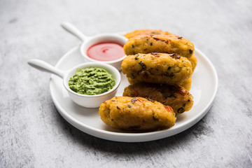 Veg Poha Roll made using flattened Rice, served with tomato ketchup and green chutney