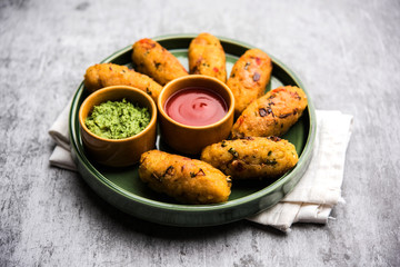 Veg Poha Roll made using flattened Rice, served with tomato ketchup and green chutney