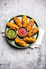 Veg Poha Roll made using flattened Rice, served with tomato ketchup and green chutney