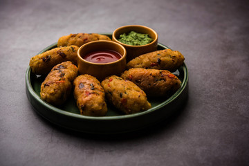 Veg Poha Roll made using flattened Rice, served with tomato ketchup and green chutney