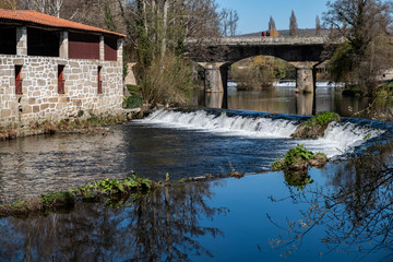 Fototapeta na wymiar Bridge and River Arnoia in Allariz, a medieval village in Galicia. Spain.