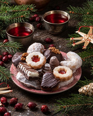 Vanilla crescents, Linzer and other traditional Christmas cookies on a plate