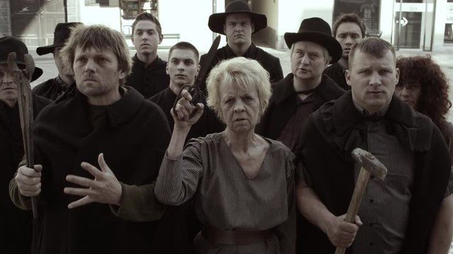 Crowd Of Craftspeople And Villagers Gets Angry And Starts Yelling At Somebody