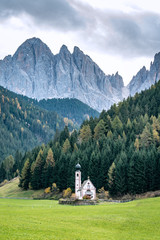 Fototapeta na wymiar St. Johann in Ranui - a small church in front of the Dolomite mountais Geissler massif