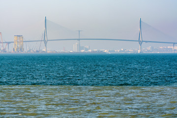 Fototapeta premium Halocline in water, visible border of fresh river water and salted ocean water with high salinity in Gulf of Cadiz, Andalusia, Spain