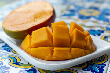 Fresh ripe mango fruit, new harvest on mangoes in Tropical Coast near Malaga, Andalusia, Spain