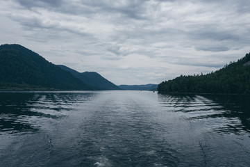 Lake Teletskoye in the mountains. In the evening you can see the hills and nature. Altai region
