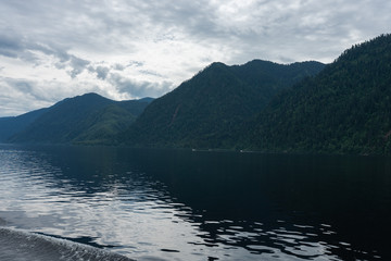 Lake Teletskoye in the mountains. In the evening you can see the hills and nature. Altai region