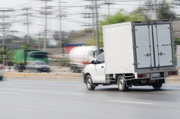 truck running on the road, small truck on the road.
