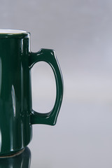 Empty mug saying different languages on isolated ground-